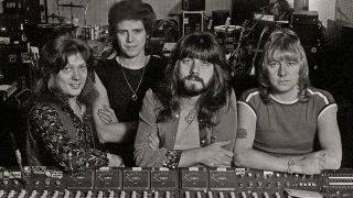 The Sweet pose around a mixing desk ina rehearsal room, United Kingdom, 1978. L-R Steve Priest, Mick Tucker, Andy Scott, Brian Connolly. (Photo by Dick Barnatt/Redferns)