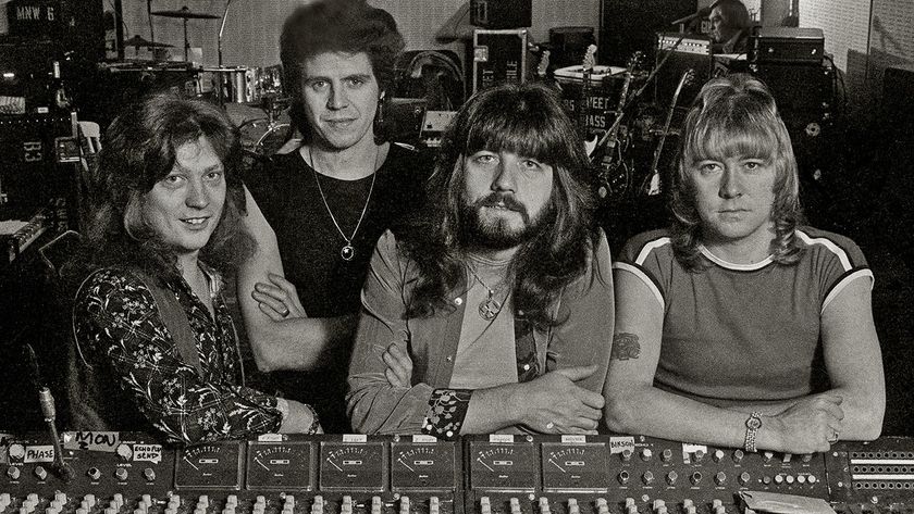 The Sweet pose around a mixing desk ina rehearsal room, United Kingdom, 1978. L-R Steve Priest, Mick Tucker, Andy Scott, Brian Connolly. (Photo by Dick Barnatt/Redferns)