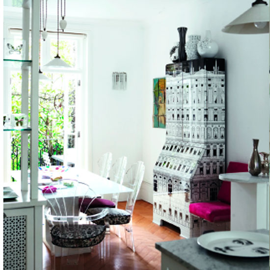 dining room with dining table and white wall