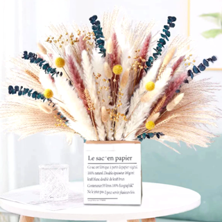 A colorful bouquet of pampas grass in a box