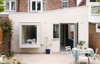 a white brick extension to a house