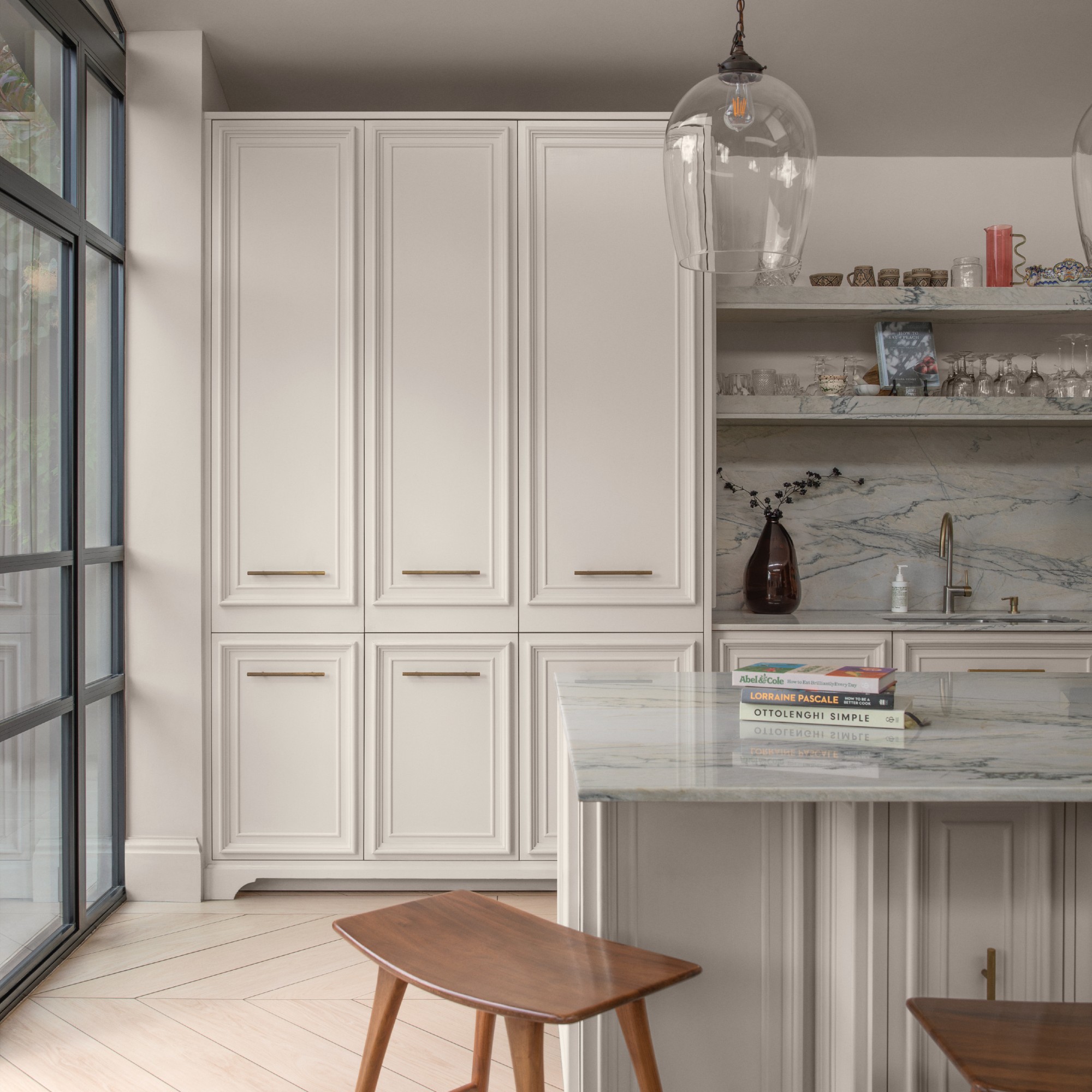A kitchen with marble worktops and splashback painted in Lick White 06