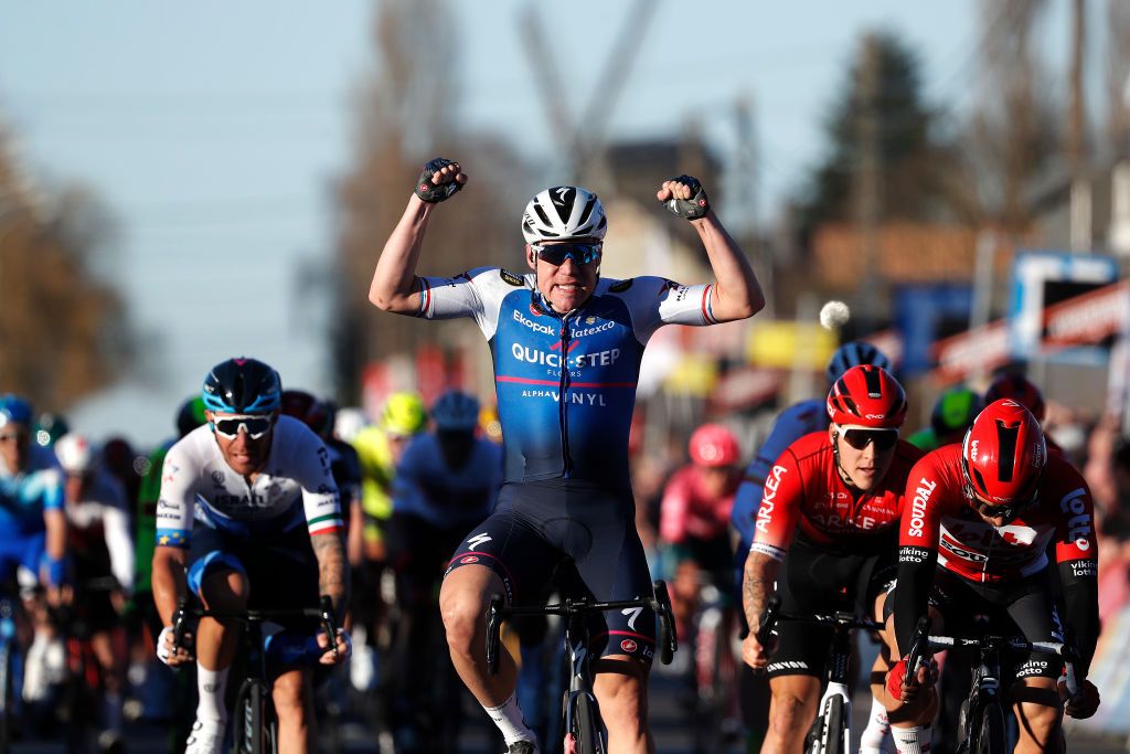 KUURNE BELGIUM FEBRUARY 27 Fabio Jakobsen of Netherlands and Team QuickStep Alpha Vinyl celebrates at finish line as race winner ahead of Caleb Ewan of Australia and Team Lotto Soudal and Hugo Hofstetter of France and Team Arka Samsic during the 74th Kuurne Bruxelles Kuurne 2022 a 1951km race from Kuurne to Kuurne KuurneBxlKuurne on February 27 2022 in Kuurne Belgium Photo by Bas CzerwinskiGetty Images