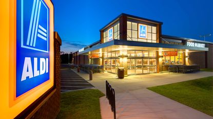 The exterior of an Aldi supermarket at dusk