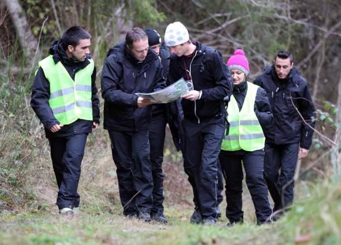 Press officer Philippe Maertens guides Frank Schleck through the wilderness.