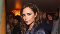 Victoria Beckham wearing satin suit in 2016