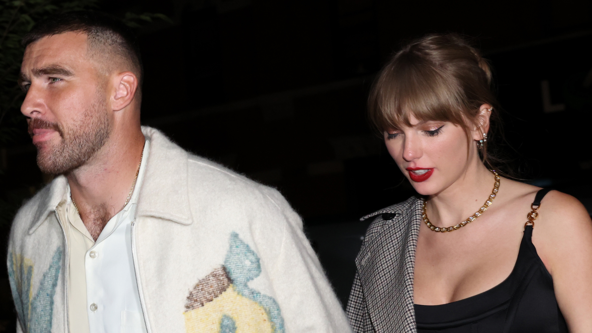 Taylor Swift wears a black corset top and has bright red lipstick on date with Travis Kelce