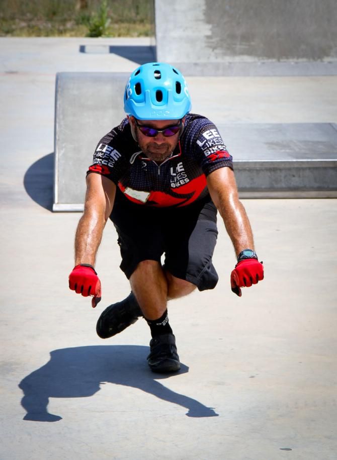Coach Lee McCormack of Lee Likes Bikes demonstrates a balance skill at a NICA advanced coach training course.