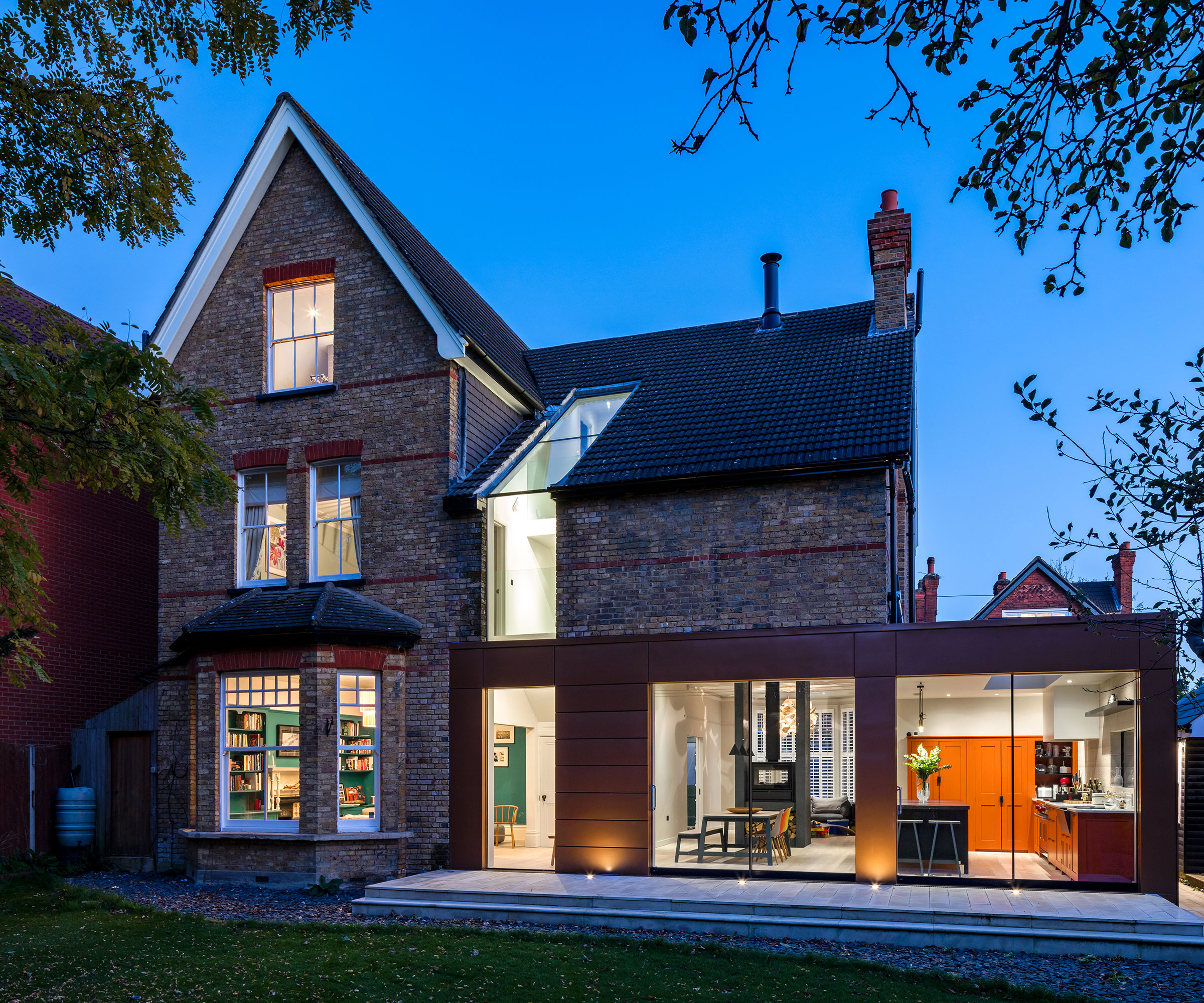 detached Victorian house with modern Corten steel extension