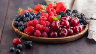 Bowl of berries, including blackberries and cherries