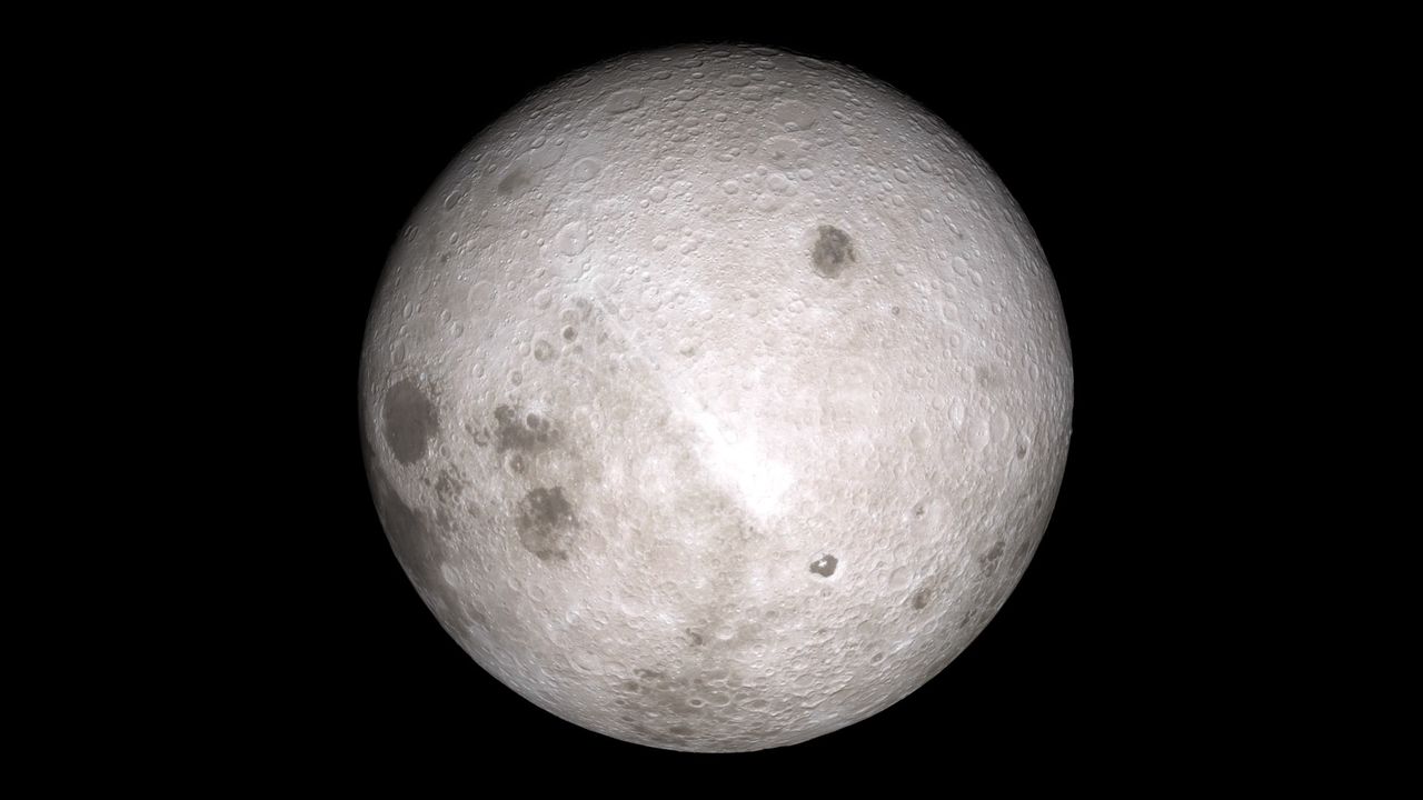 A gray sphere with various dark dots is seen against a black background