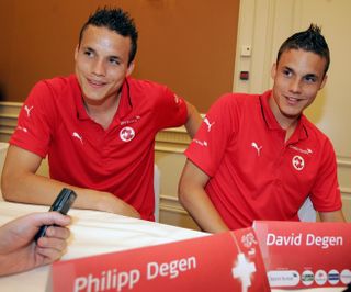 Swiss twins Philipp and David Degen speak to the media during the 2006 World Cup.