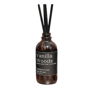 AmberandWoodCo Vanilla Wood Reed Diffuser in a brown bottle with a black label