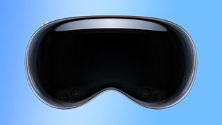 Apple Vision Pro headset front-on with a blue gradient background