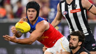 Josh Daicos of the Magpies tackles Cam Rayner of the Lions in the AFL match between Collingwood Magpies and Brisbane Lions at Melbourne Cricket Ground, on August 21, 2026, in Melbourne, Australia