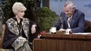 Joan Rivers and Johnny Carson sharing a laugh on The Tonight Show Starring Johnny Carson.