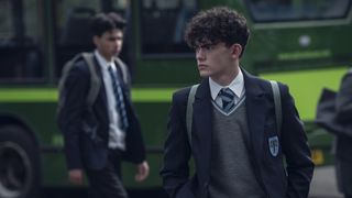 Joe Locke's Charlie scowls as he heads to school in Heartstopper on Netflix
