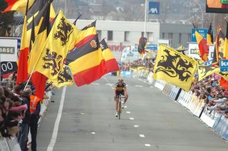 The Flemish and Belgian flags wave wildly for Tom Boonen.