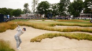 Matt Fitzpatrick of England plays a shot from a fairway bunker on the 18th hole during the final round of the 122nd U.S. Open Championship