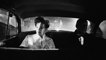 Judy Garland in the back of a car shot in black and white by photographer Douglas Kirkland
