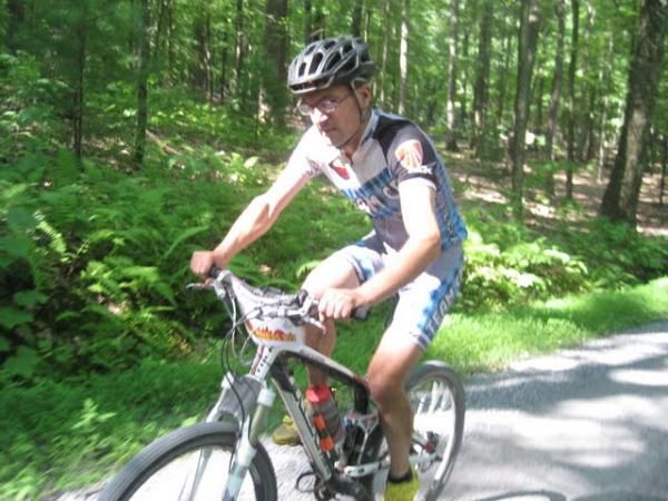 Christian Tanguy rides back through the field after suffering drivetrain issues caused by a tired derailleur.