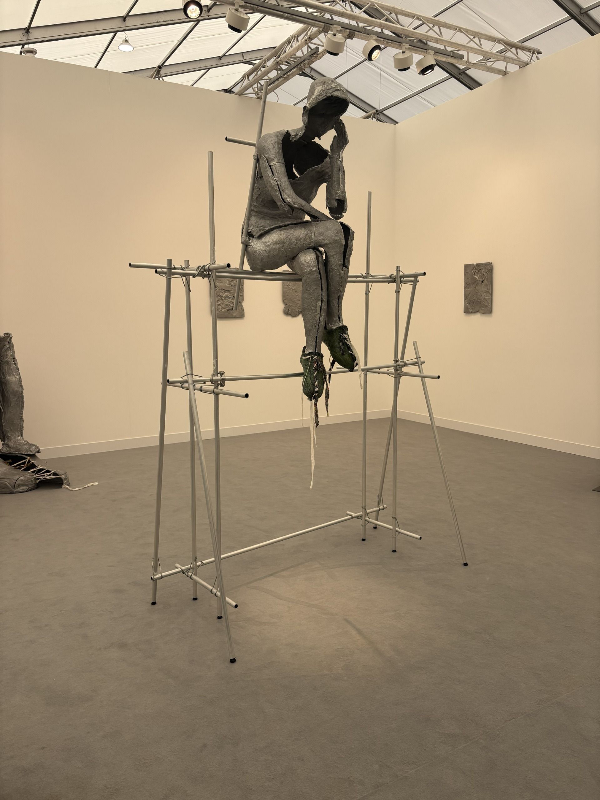 Installation views of an art fair with large-scale sculptural artworks, wall art, and colossal installations.