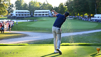 Sam Burns hits a fairway wood off the tee