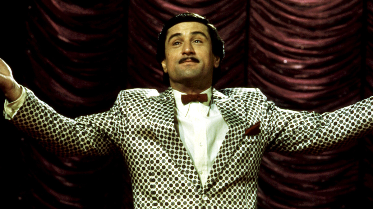 Robert De Niro stands on stage in The King of Comedy