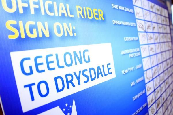 Riders sign on for the start of stage 3.