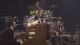 (from left) Paul McCartney, John Lennon, Ringo Starr, and George Harrison, performing the Beatles' Hey Jude