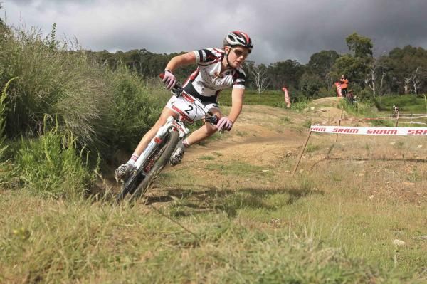 A rider rounds a bend on the cross country course.