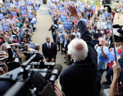 Bernie Sanders greets a crowd of supporters.