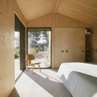 Bedroom interior at Pine Nut Cabane, a French cabin by daab design