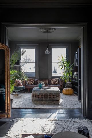 dark grey living room with eclectic mix of furniture