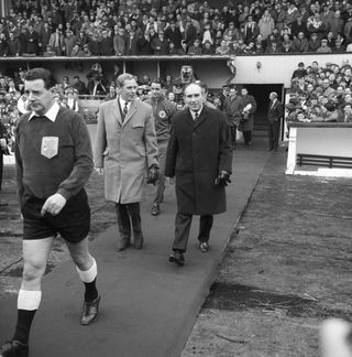 Bobby Brown, left, walks out with England manager Alf Ramsey