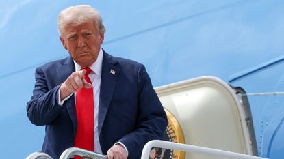 Donald Trump arrives for the memorial service of Charlie Kirk