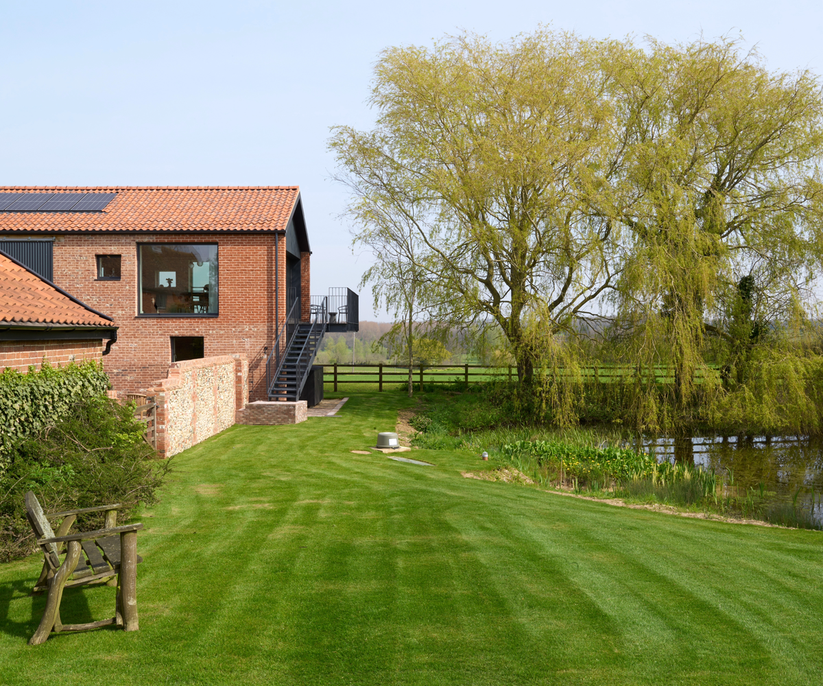 Lawn and lake on the right hand side of the house