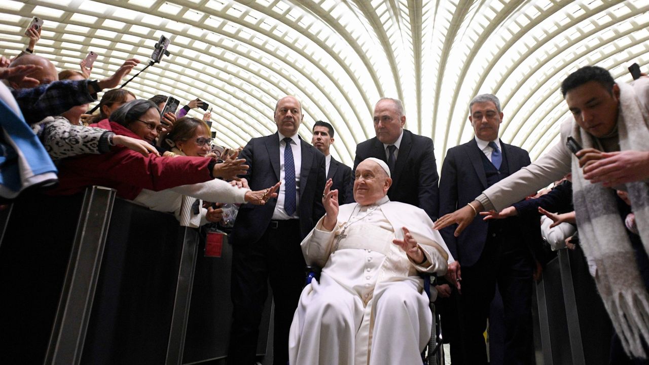 Pope Francis greets worshippers during his audience in Vatican City on Feb. 12, 2025. 