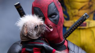 Deadpool holds Dogpool.