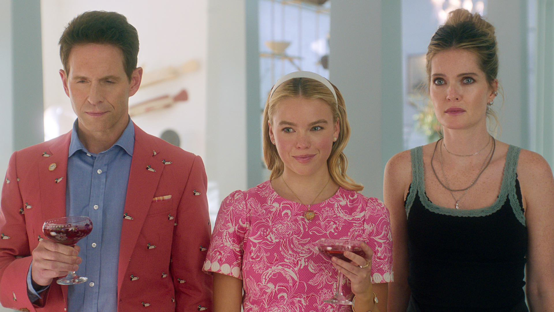 an actress on Sirens wears the nantucket basket necklace with a Lily Pulitzer dress