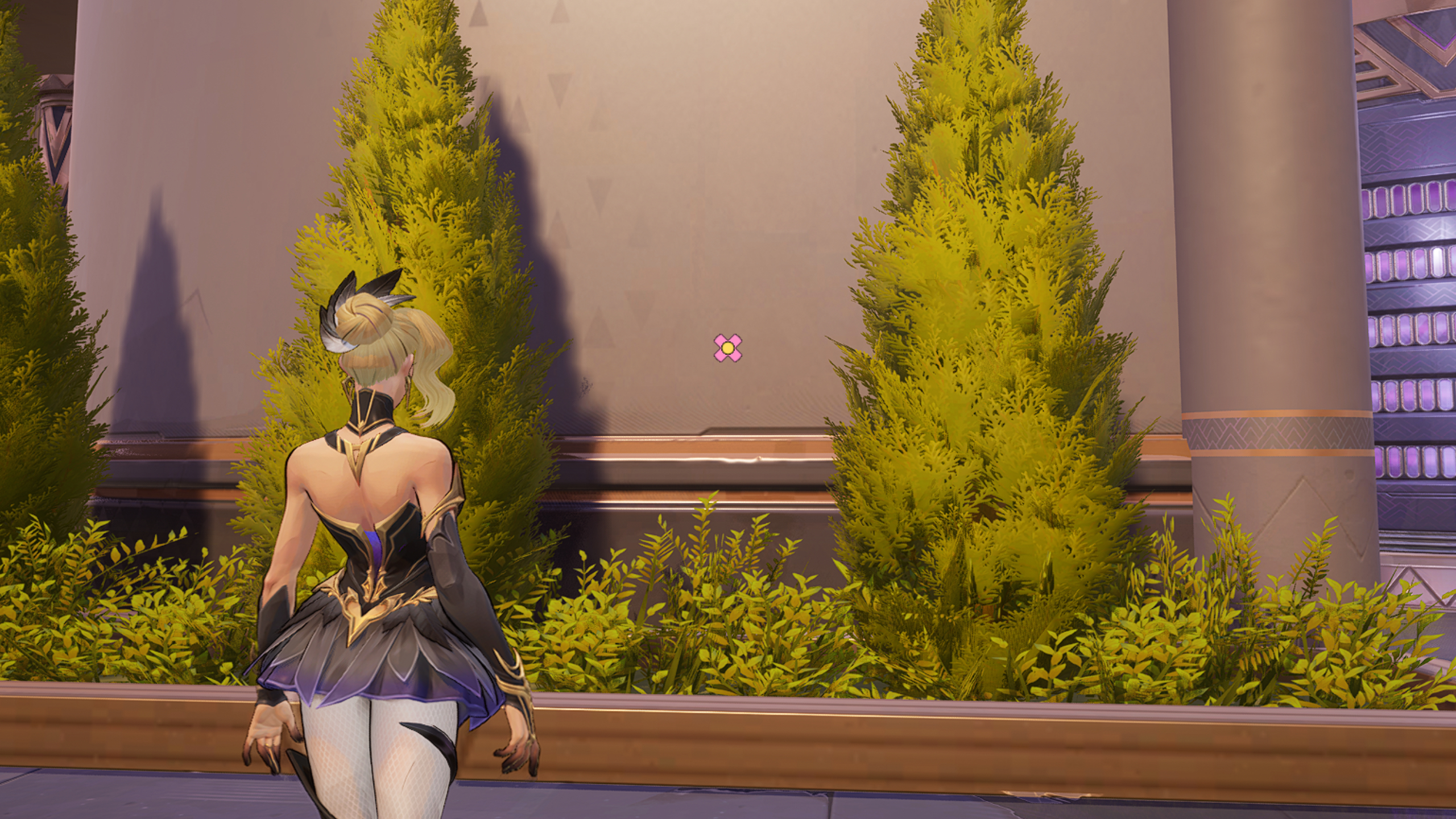 Best Marvel Rivals crosshairs: Cloak looking at a wall with two small trees either side of a pink flower reticle.