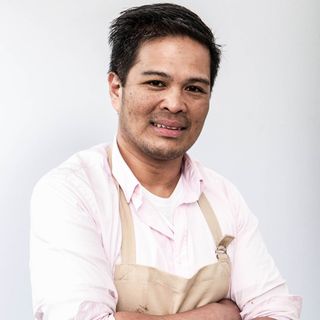 bake off contestant with pink shirt and apron