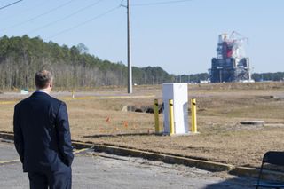 Outgoing NASA Administrator Jim Bridenstine peers at the B-2 Test Stand at Stennis Space Center near Bay St. Louis, Mississippi, prior to a hot fire test Jan. 16, 2021, of the core stage for the agency's Space Launch System rocket.
