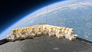 1,000 LEGO astronauts seated on a mini-space shuttle during a ride on a stratospheric balloon to the edge of space.