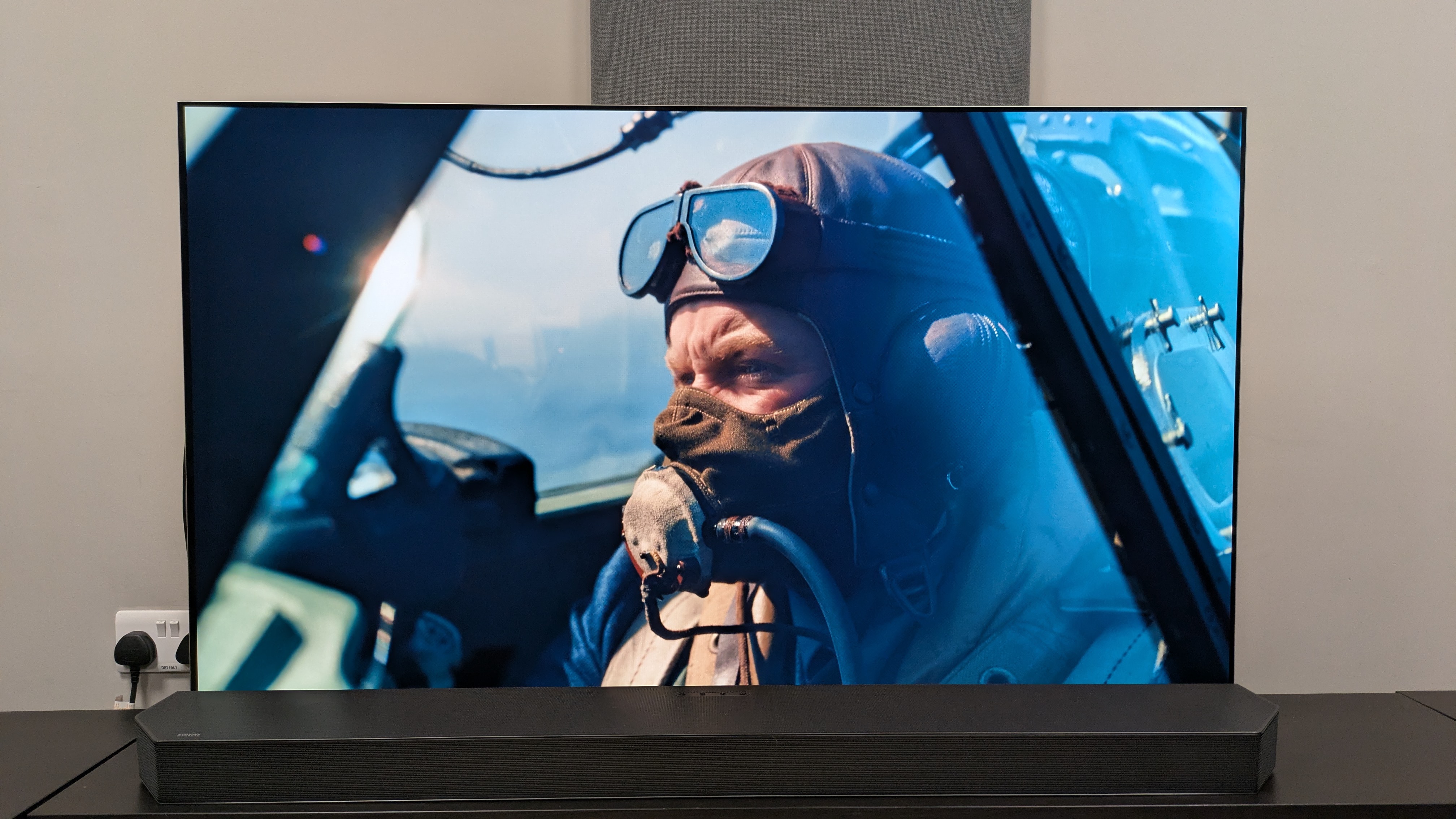Dunkirk 4K Blu-ray on LG G6 TV, showing a close-up shot of a British pilot in the cockpit of a plane