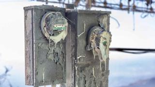 A power meter remains at the incinerated land-mobile communications building on Mt. Wilson following the Eaton fire.