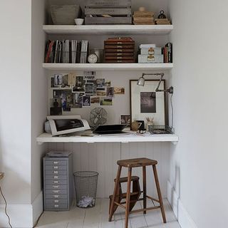 study room with white shelves on wall
