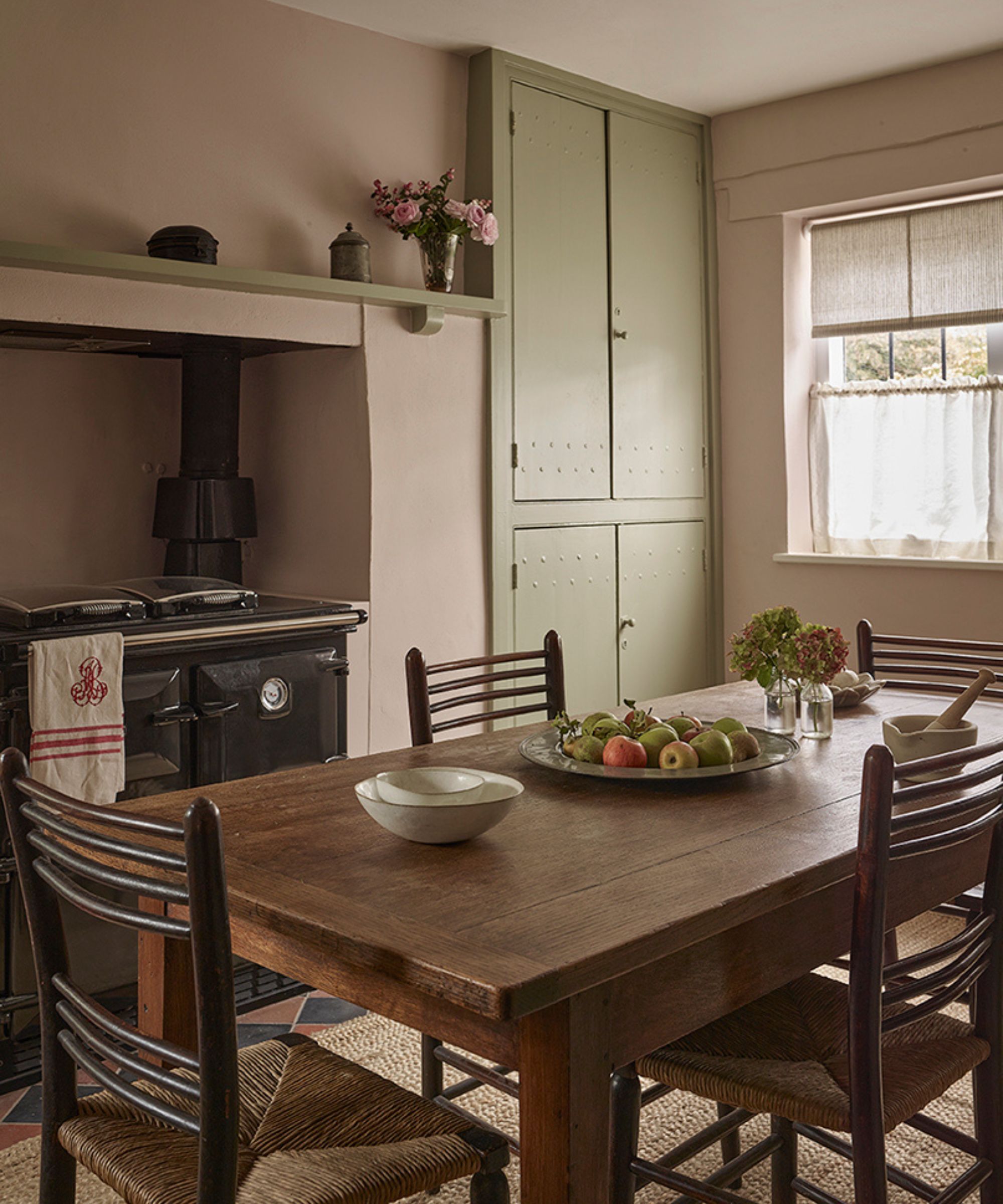 a cottage pale green breakfast room in hampstead, london