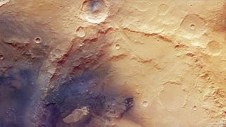 Portion of an image taken on Oct. 12, 2024, by the European Space Agency's Mars Express orbiter showing the heavily cratered highlands of Mars' ancient Arabia Terra region. The photo is dominated by the old, eroded Trouvelot Crater.