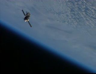 A Soyuz TMA-09M spacecraft is seen by cameras on the International Space Station after the two spacecraft undocked on Nov. 10, 2013. Riding home on the Soyuz were the Olympic torch and Expedition crewmembers Fyodor Yurchikhin of Russia, Karen Nyberg of NA
